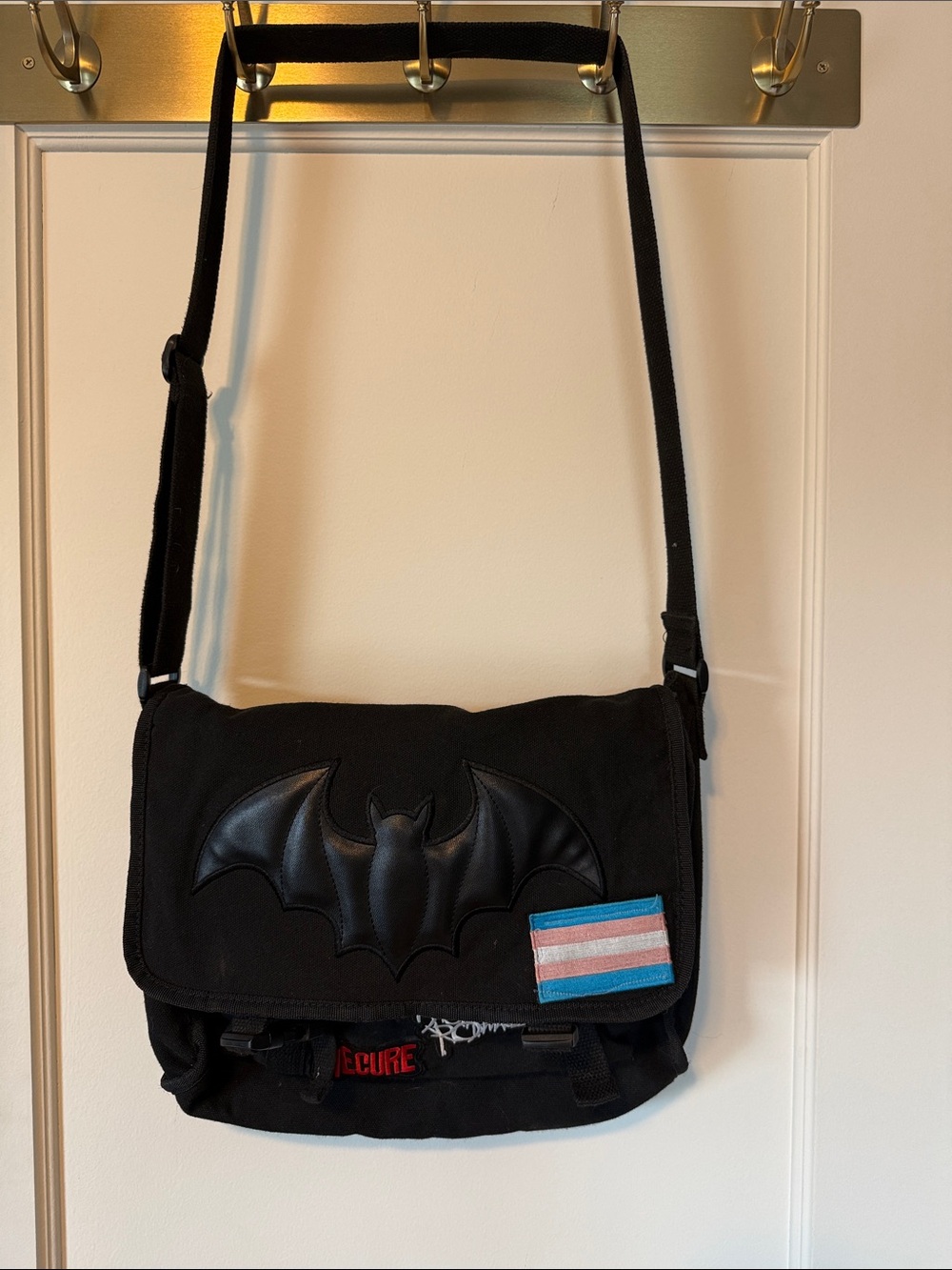 Banned Alternative bat messenger bag with assorted patches